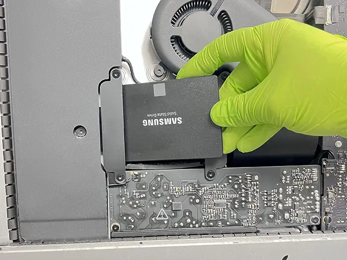 Silver iPhone with cracked screen